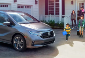 A family leaving their house and entering their 2024 Honda Odyssey near Ontario, California